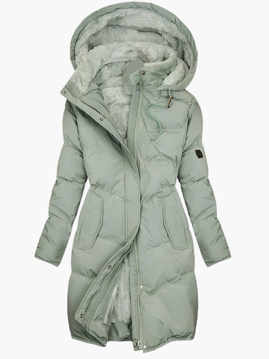 Long sage green quilted winter coat with a lined hood, long sleeves, front closures, and two side pockets.