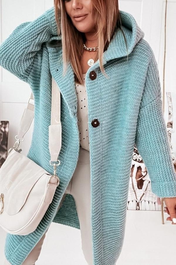 Aqua longline hooded cardigan with large buttons and long sleeves, styled open over a light outfit.
