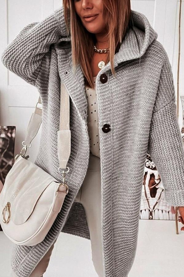 Gray hooded button cardigan in close front view, highlighting its textured surface and two visible buttons.