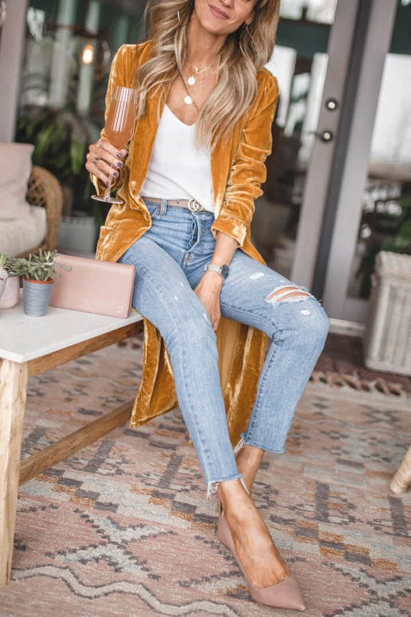 Front view of the mustard longline kimono coat worn open with jeans, emphasizing its relaxed layered silhouette.