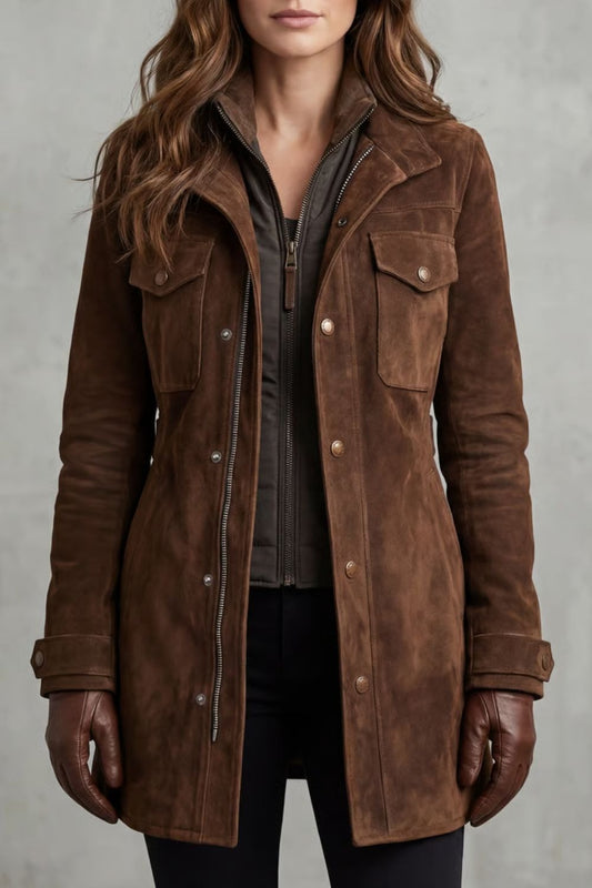 Front close-up of a longline brown coat with a stand collar, layered snap and zip closure, flap utility pockets, and tab cuffs.
