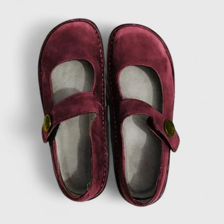 Burgundy Mary Jane flats viewed from above, showing the deep red color, rounded toes, and adjustable instep straps.