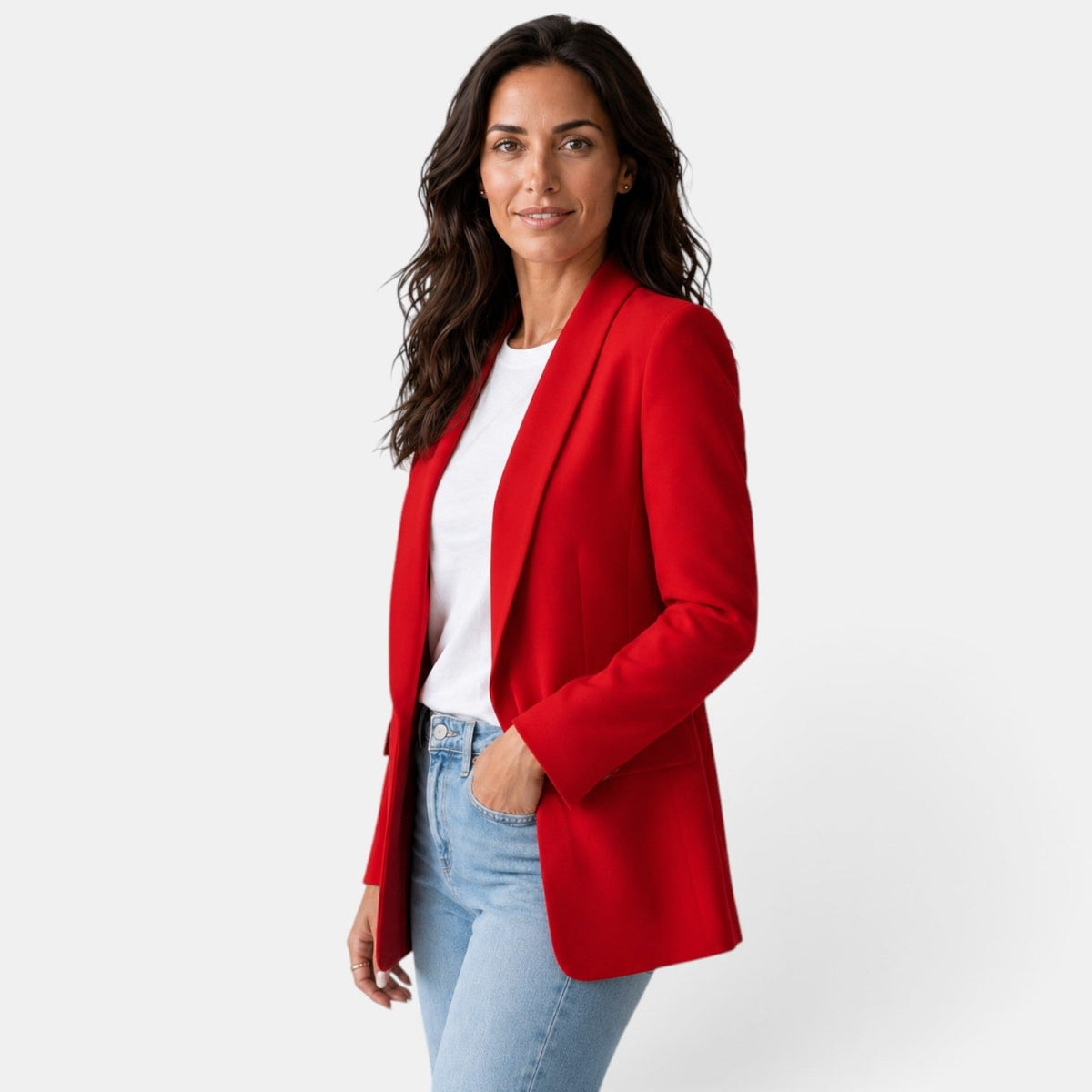 Three-quarter front view of the red blazer with one hand in a flap pocket and the open shawl-collar front visible.