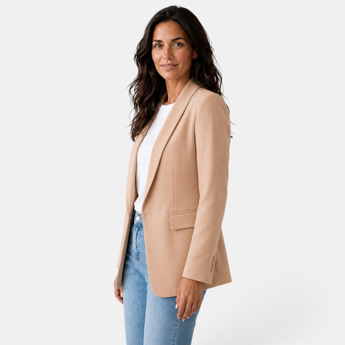 Three-quarter front view of the tan blazer highlighting its straight fit, long sleeve, and side flap pocket.
