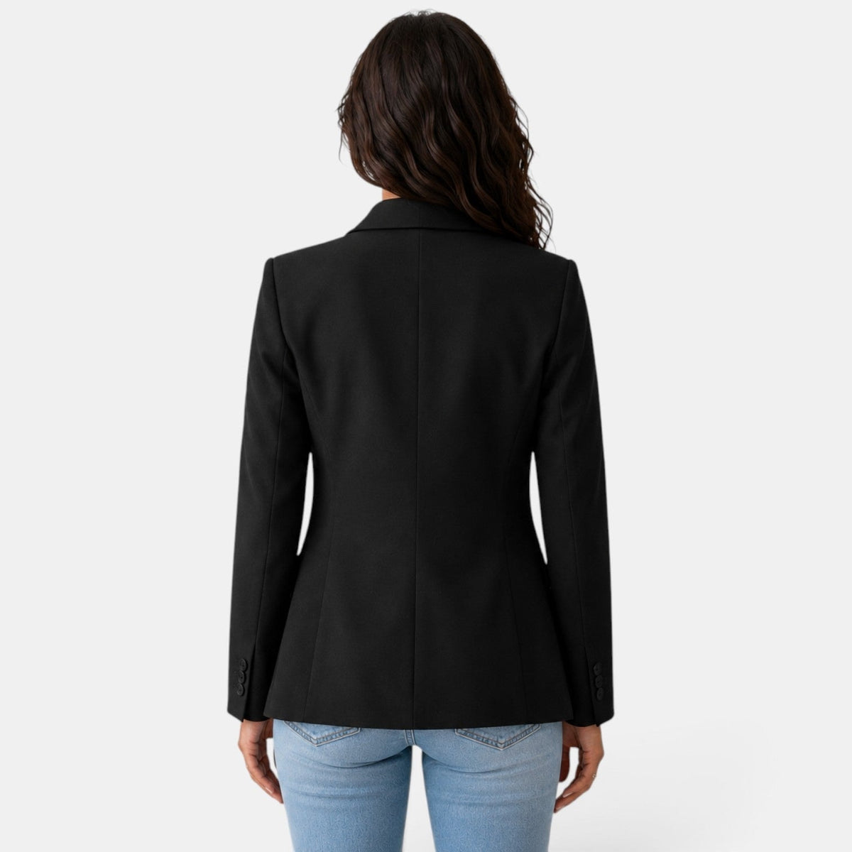 Back view of the black blazer showing the center seam, fitted waist shaping, and long sleeves.