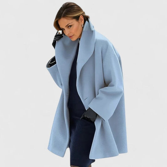 Light blue oversized coat with a wide lapel collar, long sleeves, and open front styling.