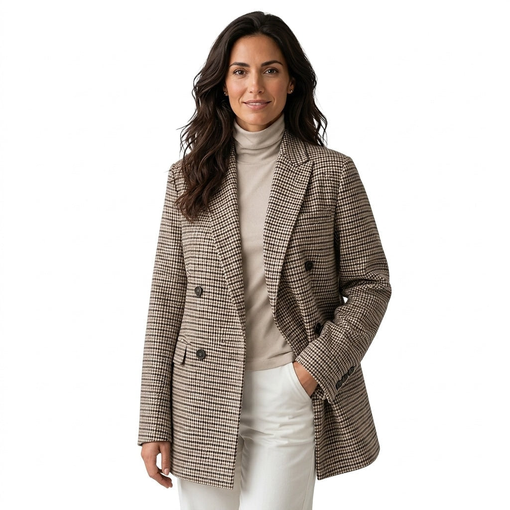 Front view of an oversized houndstooth blazer with a notched lapel, double-breasted button front, long sleeves, and flap pockets.