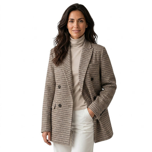Front view of an oversized houndstooth blazer with a notched lapel, double-breasted button front, long sleeves, and flap pockets.