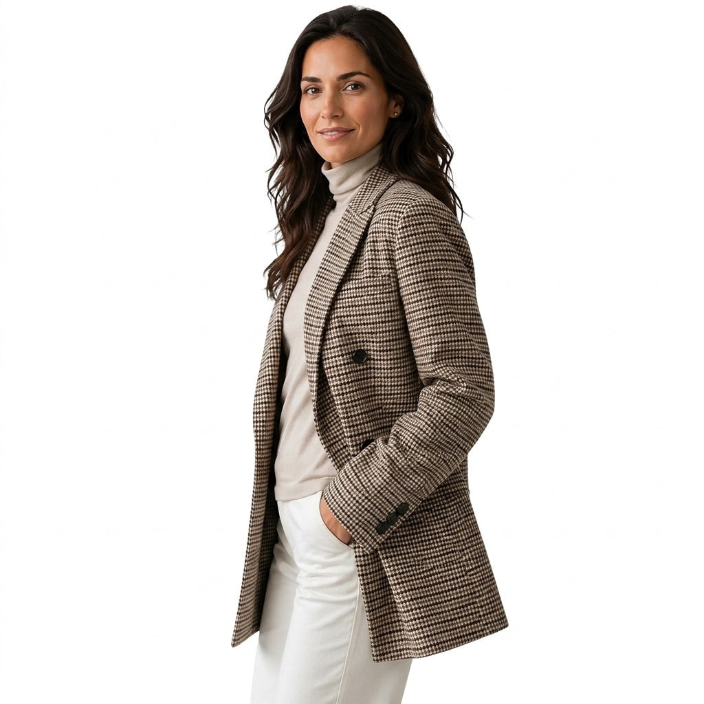 Three-quarter side view highlighting the relaxed oversized cut, patterned long sleeve with buttoned cuff, and front flap pocket.