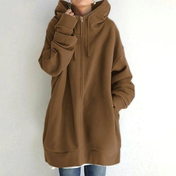 Front view of the longline zip-up hoodie in brown, showing its roomy sleeves, drawstring hood, and extended hem.