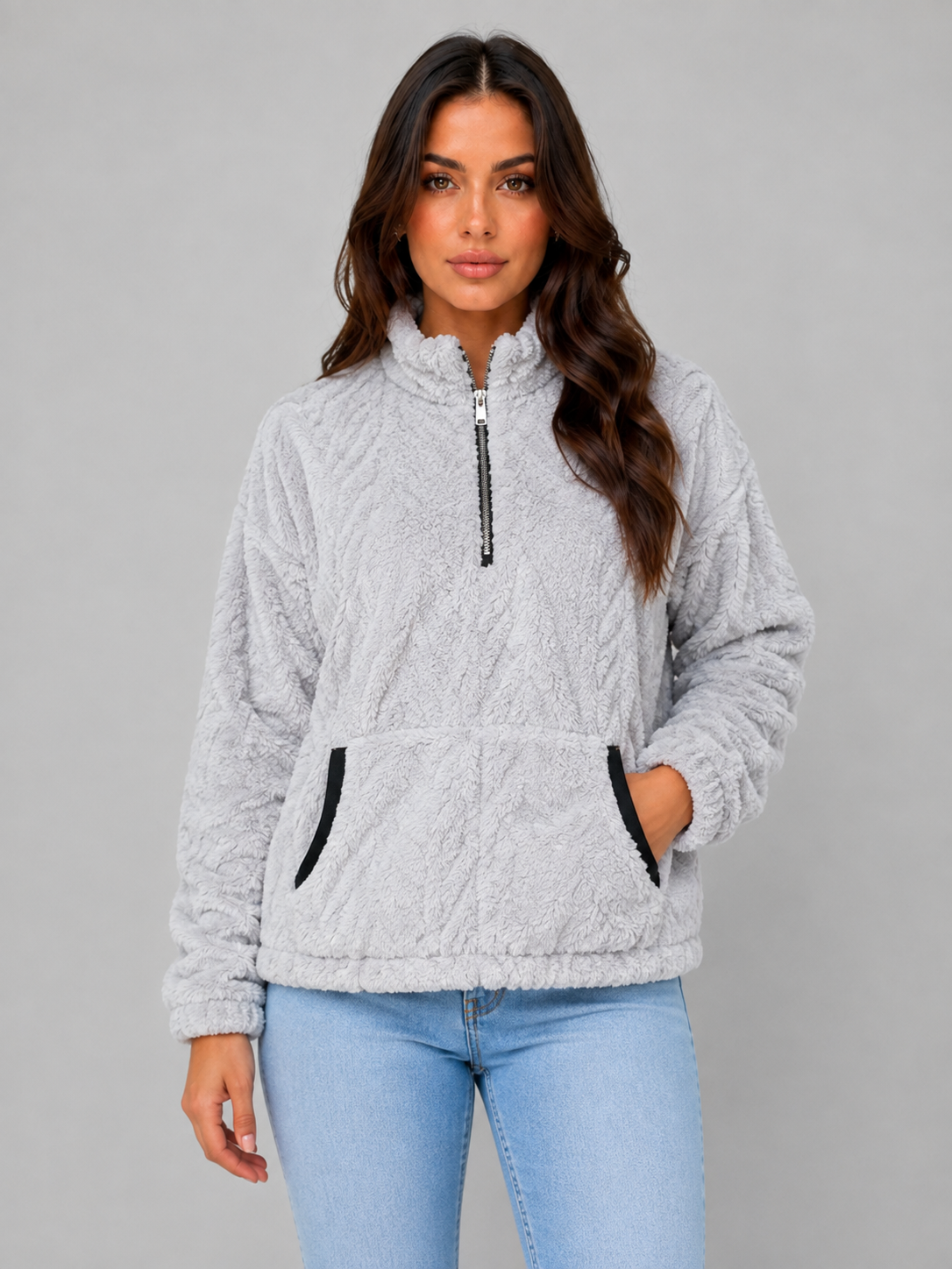 Light gray plush half-zip pullover with a front kangaroo pocket and high neckline, shown from the front.