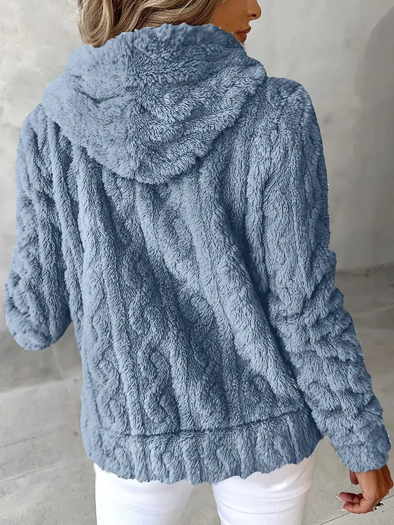 Back view of the blue-gray plush jacket highlighting the hood and relaxed fit.