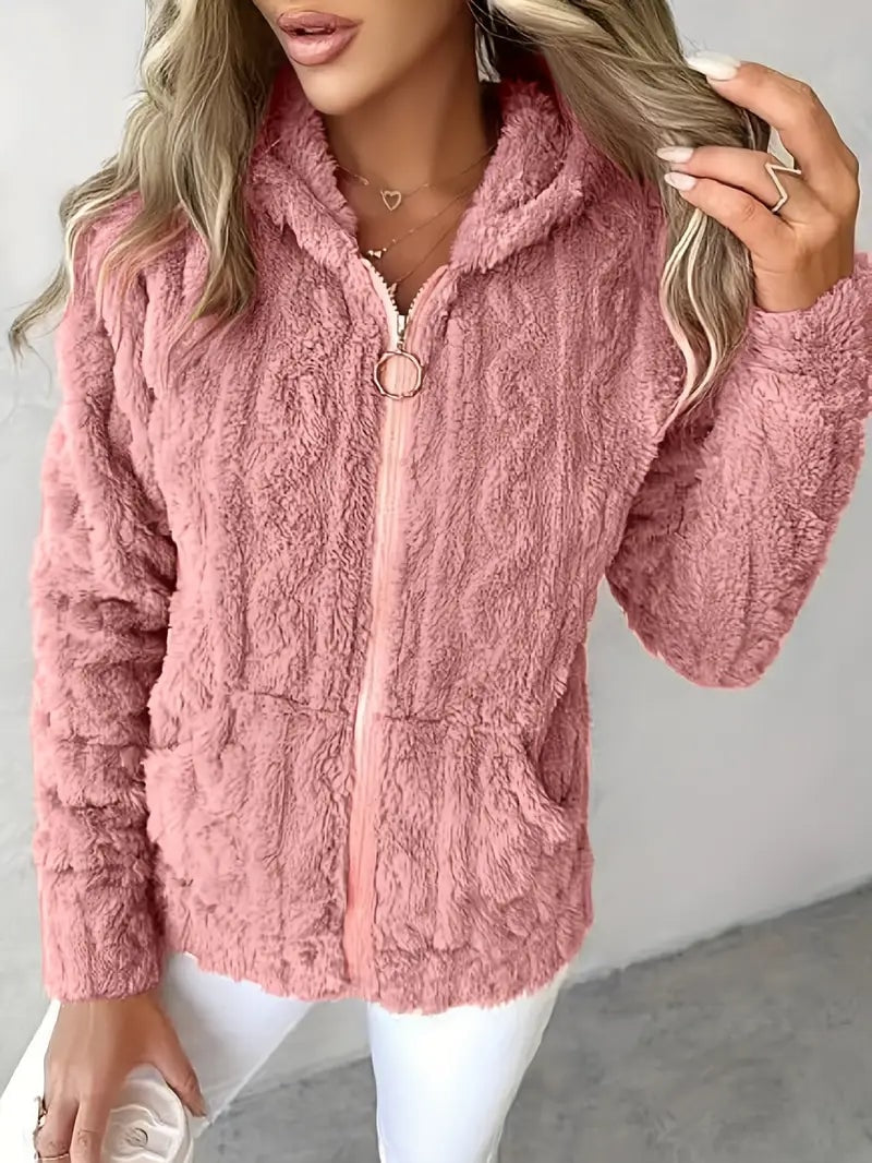 Pink plush zip-up jacket with a hood, circular zipper pull, and two front patch pockets.