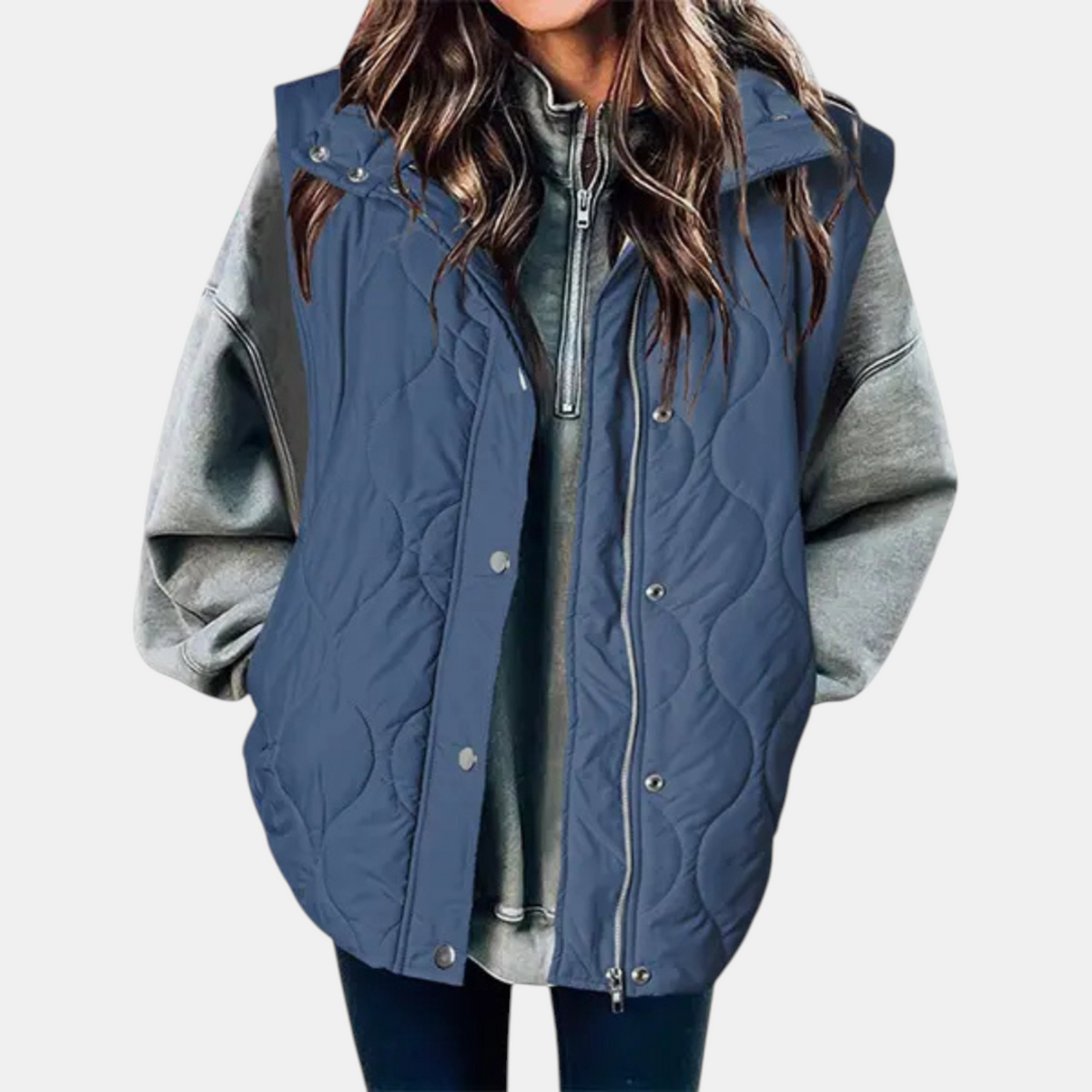 Navy blue quilted hooded vest shown over a grey sweatshirt, with front zipper and snaps visible.