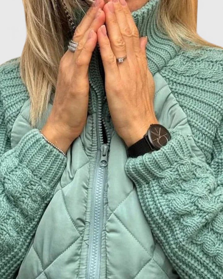Close-up of the mint green jacket showing diamond quilting, textured sleeve details, raised collar, and front zipper.