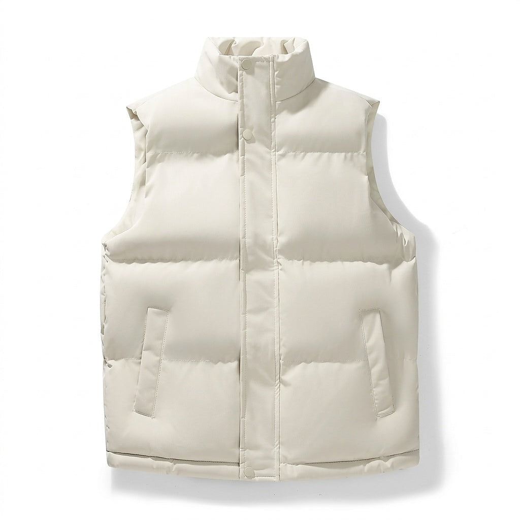 Front view of a cream quilted puffer vest with a stand collar, covered snap closure, horizontal panels, and two side pockets.