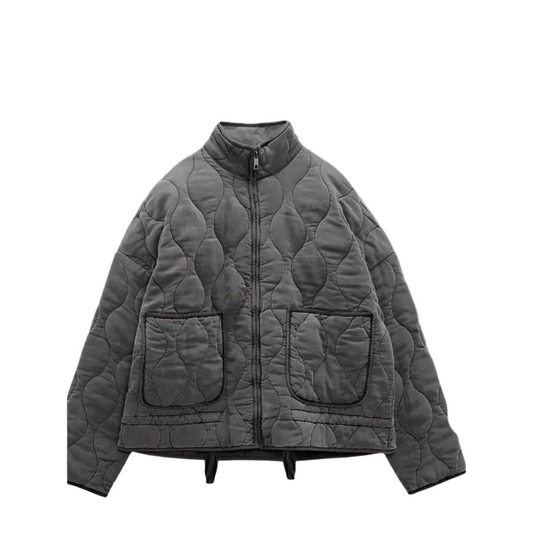 Front view of a dark gray short quilted jacket with a stand collar, zip closure, long sleeves, and two front patch pockets.