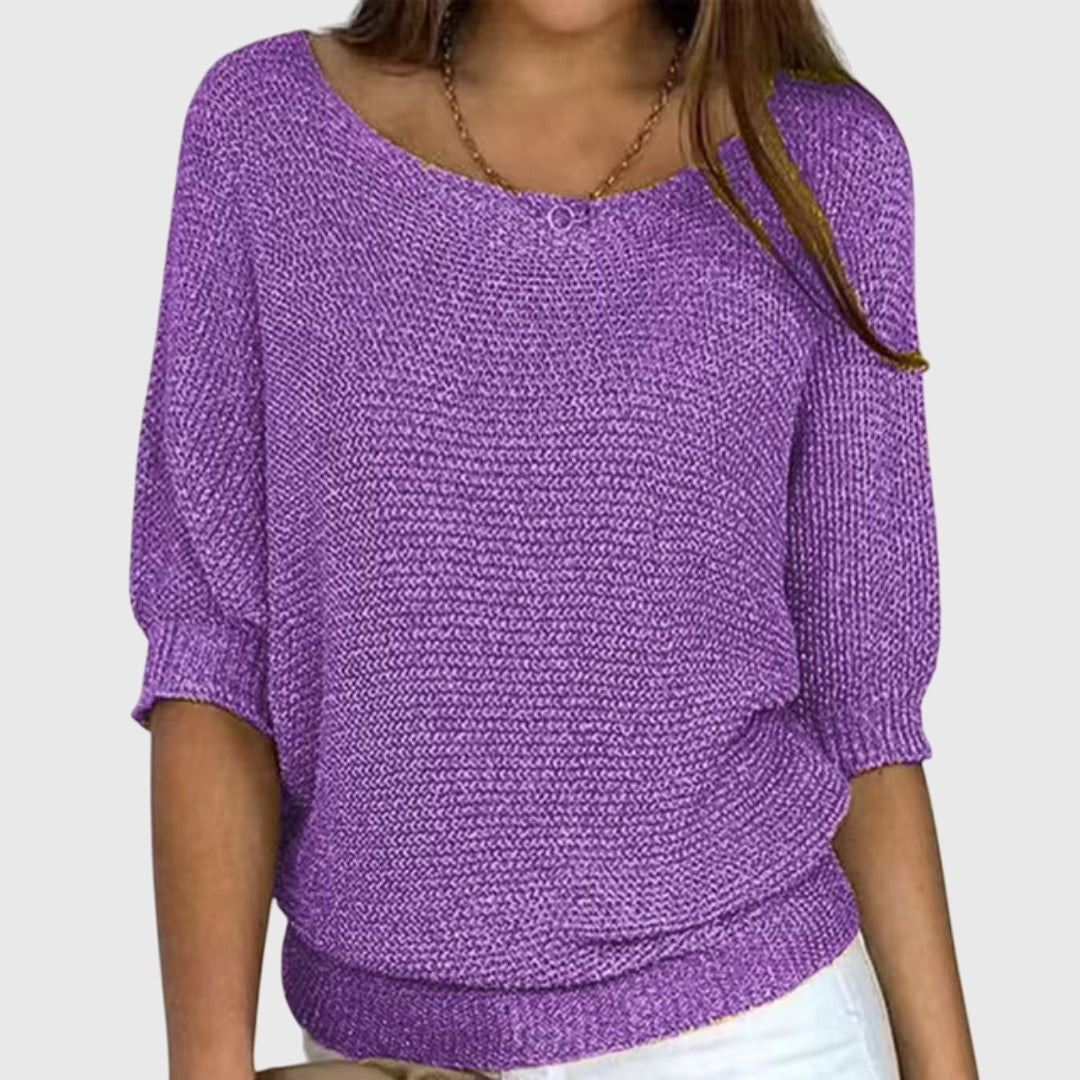 Purple textured sweater with a loose fit, wide neckline, and lightweight three-quarter sleeves.