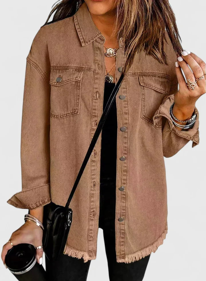 Brown casual trucker jacket showing its oversized shape, pointed collar, long sleeves, and two button-flap pockets.