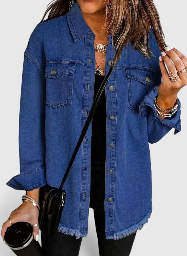 Dark blue button-front jacket with a relaxed fit, traditional trucker pockets, and a raw fringed hem.