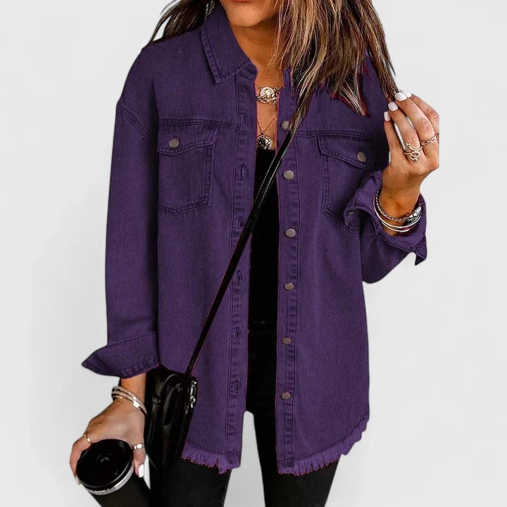Deep purple trucker jacket with a pointed collar, button cuffs, two chest pockets, and a raw uneven hem.