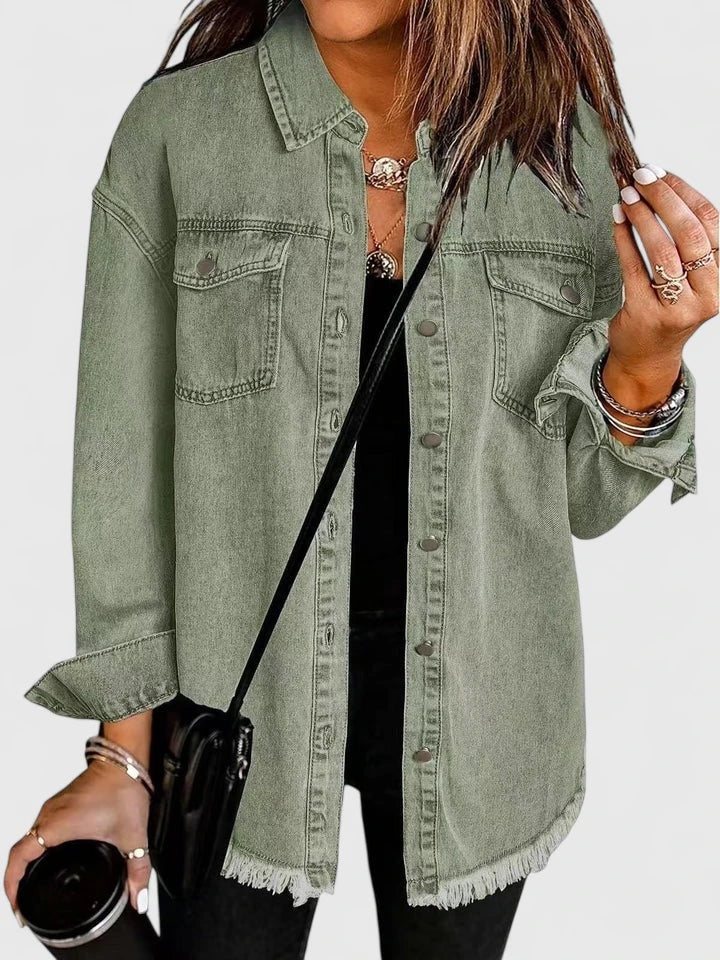 Muted olive-green jacket with a relaxed silhouette, button-front closure, flap chest pockets, and frayed lower edge.
