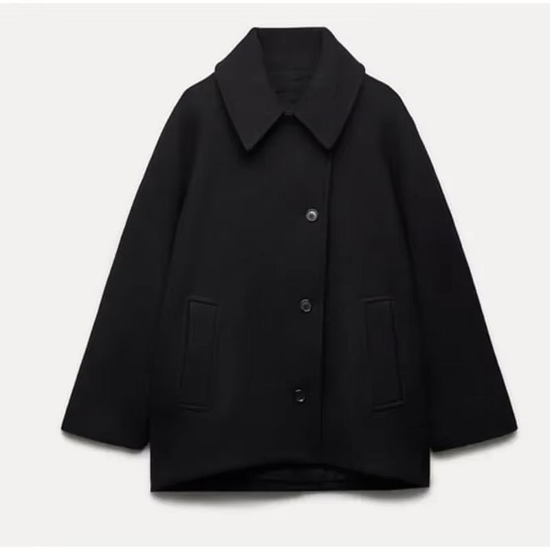 Black short coat displayed flat, showing the pointed collar, long sleeves, front buttons, and two side pockets.