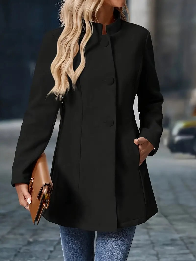 Black coat fully closed from the front, showing the high stand collar and vertical button line.