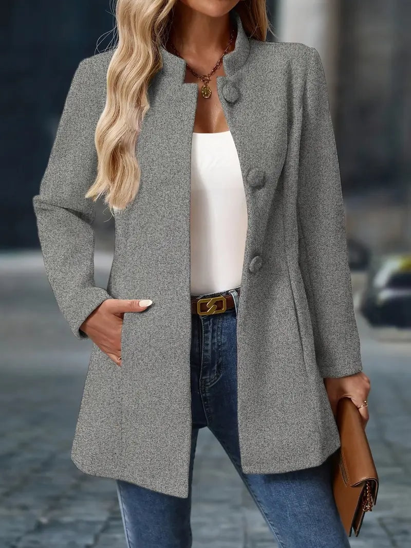 Gray textured-looking stand-collar coat shown open, highlighting its long sleeves and thigh-length cut.