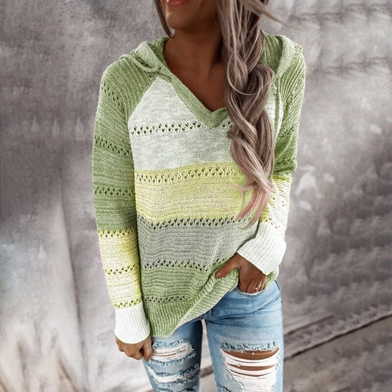 Green and pale yellow striped openwork hooded sweater shown from the front with long sleeves and white cuffs.