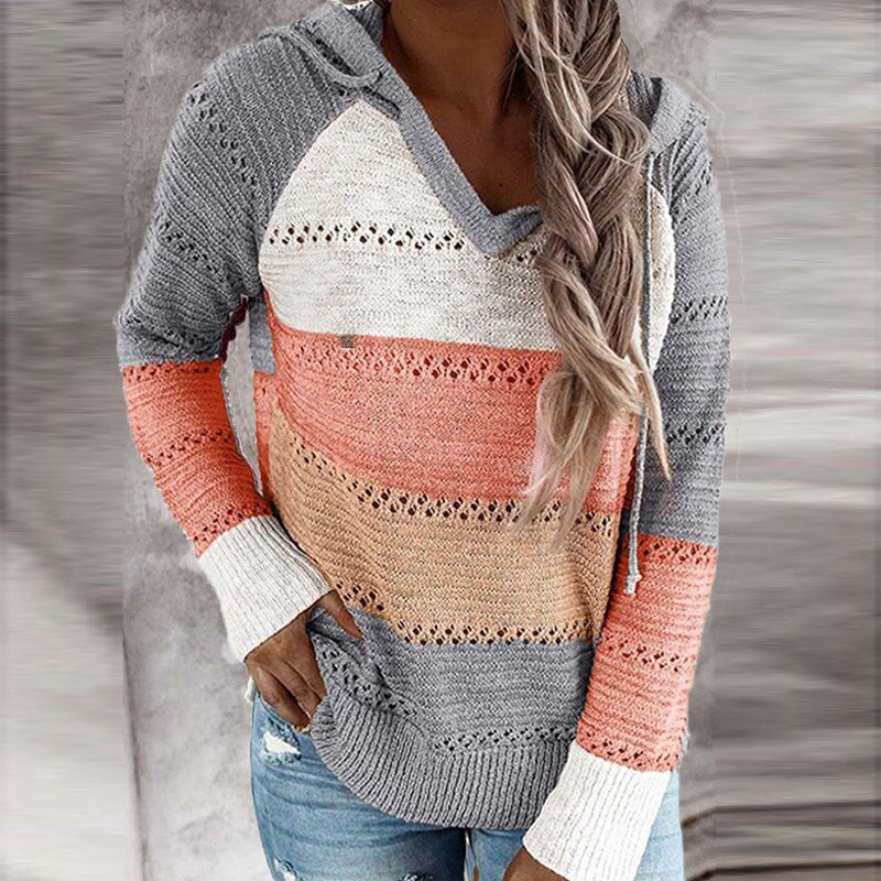 Gray, coral, cream, and beige striped hooded sweater with openwork detailing and contrasting white cuffs.