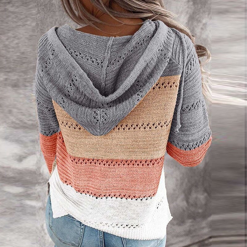 Back view of the gray, beige, coral, and cream striped sweater, clearly showing the attached hood and openwork stripe details.