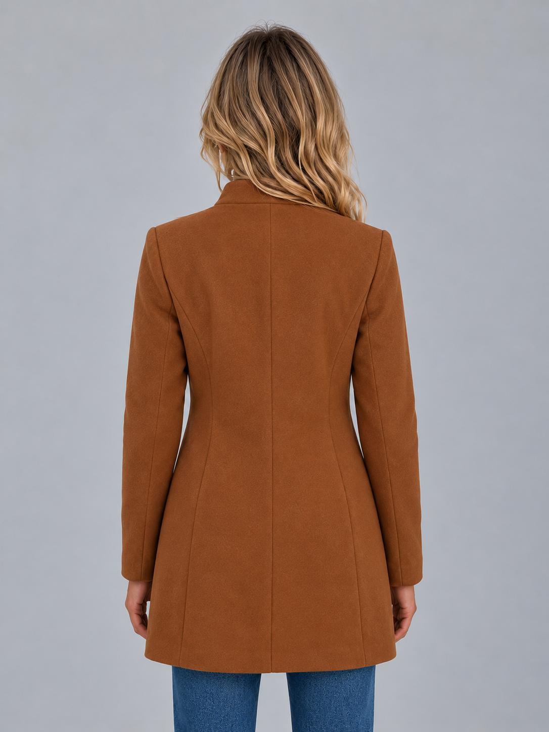 Back view of the brown longline coat, showing its streamlined silhouette, center back seam and gently shaped waist.