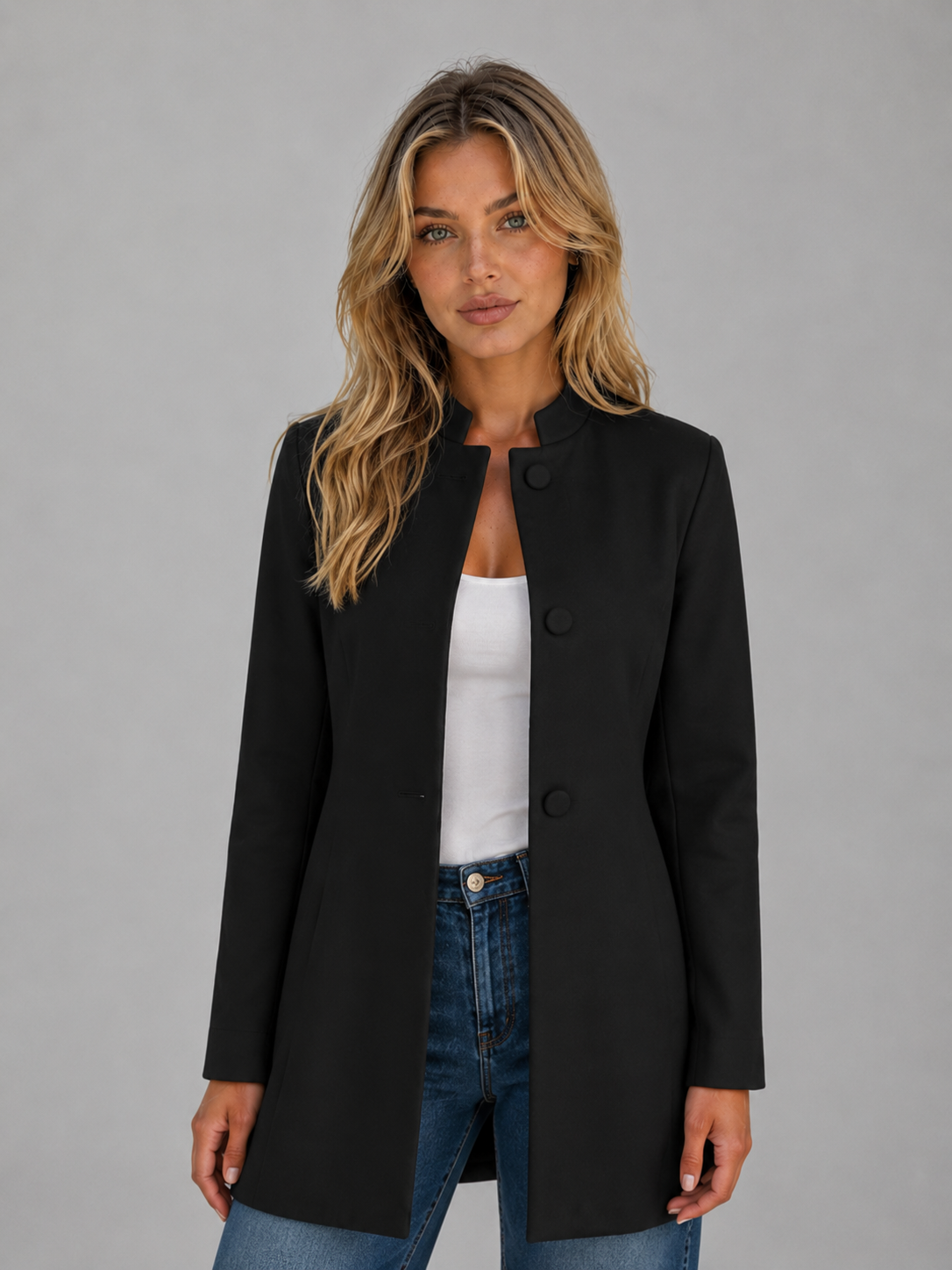 Front view of the black tailored longline coat with a round neckline, button-front closure, subtle waist shaping and long sleeves.