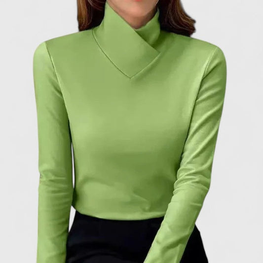 Lime green long-sleeve turtleneck top with an asymmetric folded neckline and close-fitting silhouette.