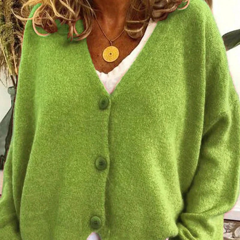 Lime green V-neck cardigan with visible front buttons and relaxed long sleeves.