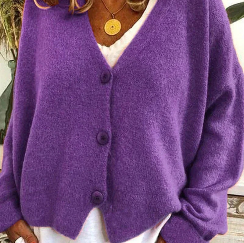 Purple button-front cardigan displaying its V-neckline, long sleeves, and relaxed fit.