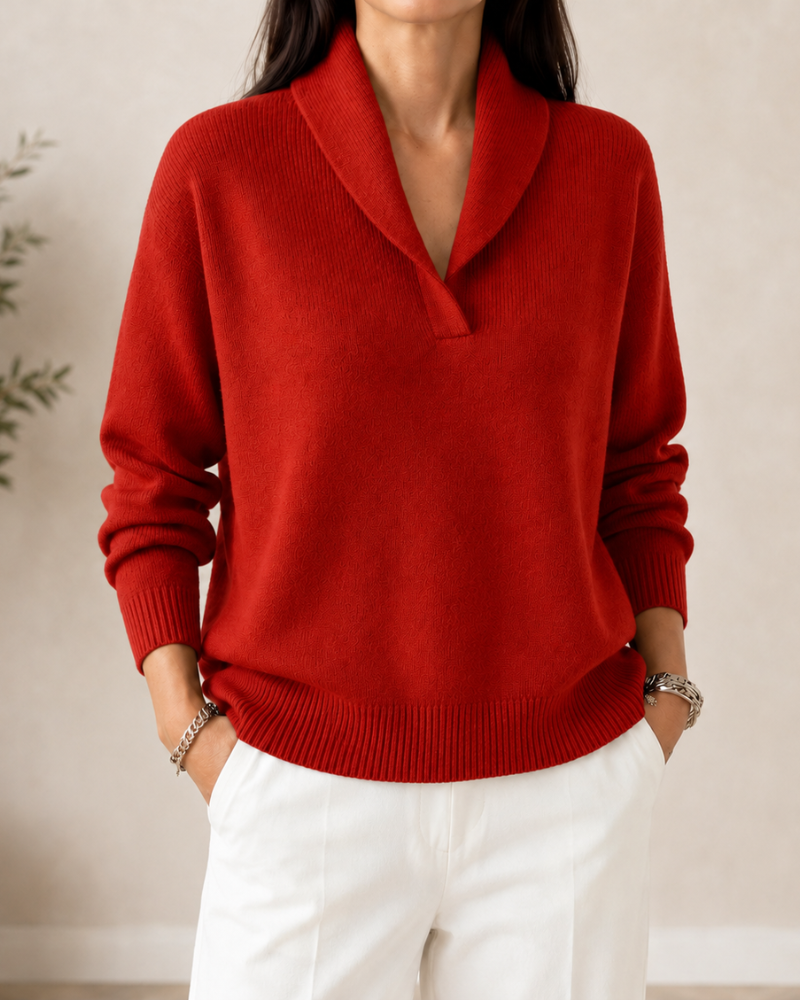 Bright red shawl-collar sweater with a V-neck, long sleeves, and ribbed lower edge.