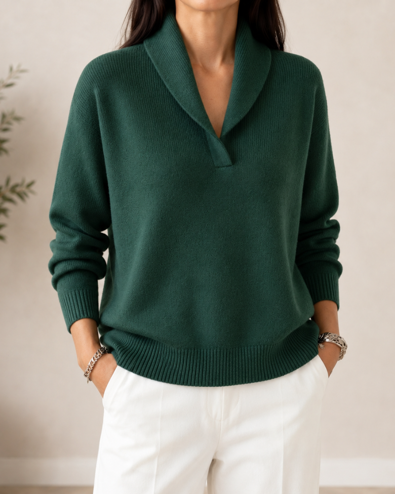Front view of the dark green shawl-collar sweater, highlighting its relaxed shape, deep V-neck, and ribbed hem.