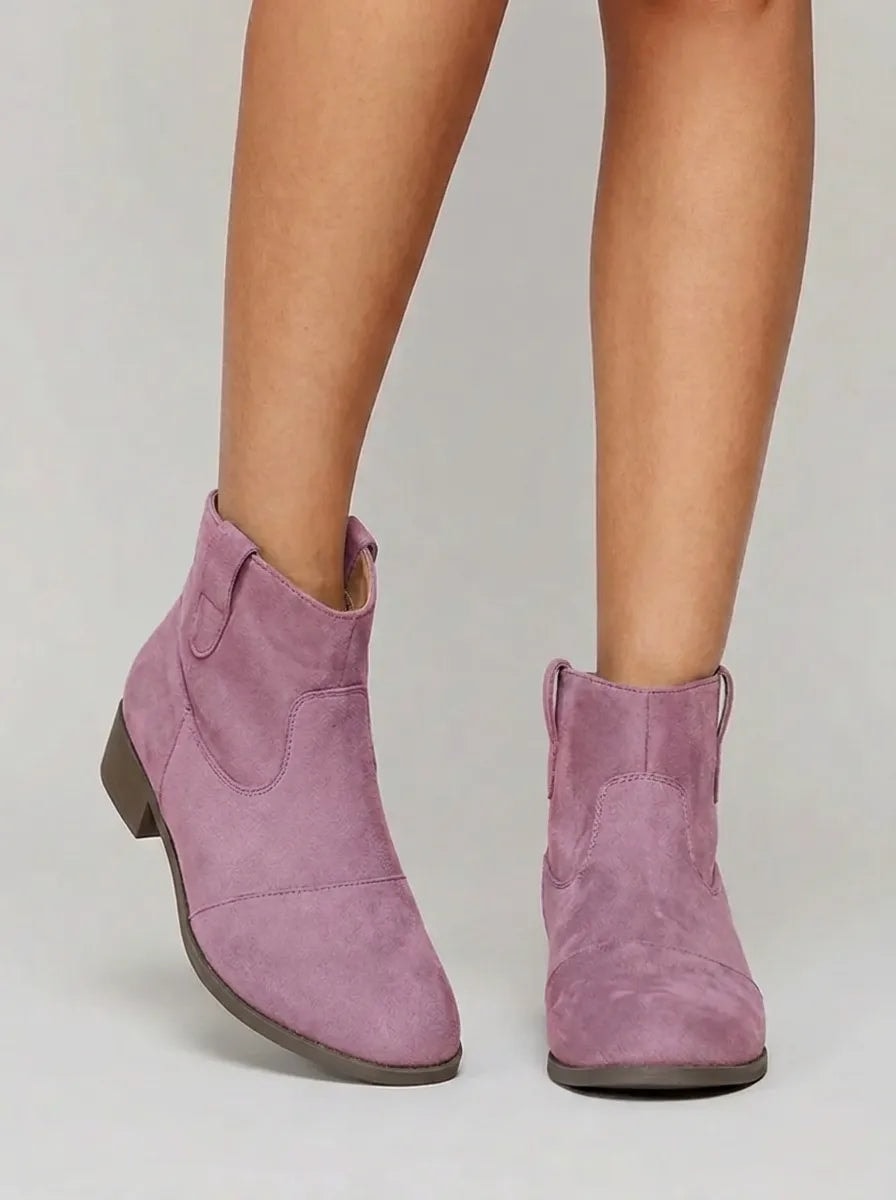 Mauve Western ankle boots shown from the front, featuring ankle-height shafts, decorative stitching, and low heels.