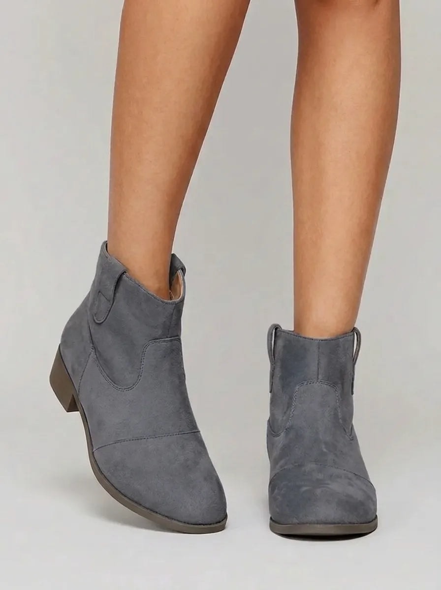 Gray Western ankle boots shown in a front three-quarter view with decorative stitching, pull tabs, and low heels.