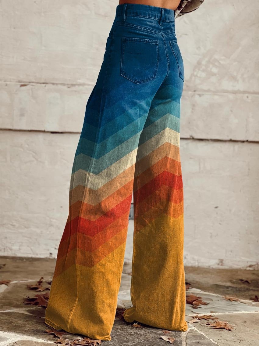 Back view of the wide-leg pants showing the high waistband, rear pockets, and multicolored chevron pattern extending across the voluminous full-length legs.