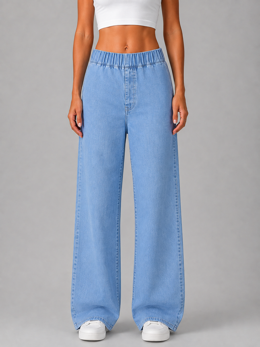 Front view of light blue wide-leg pull-on jeans with an elasticated high waist and full-length legs, styled with white trainers.