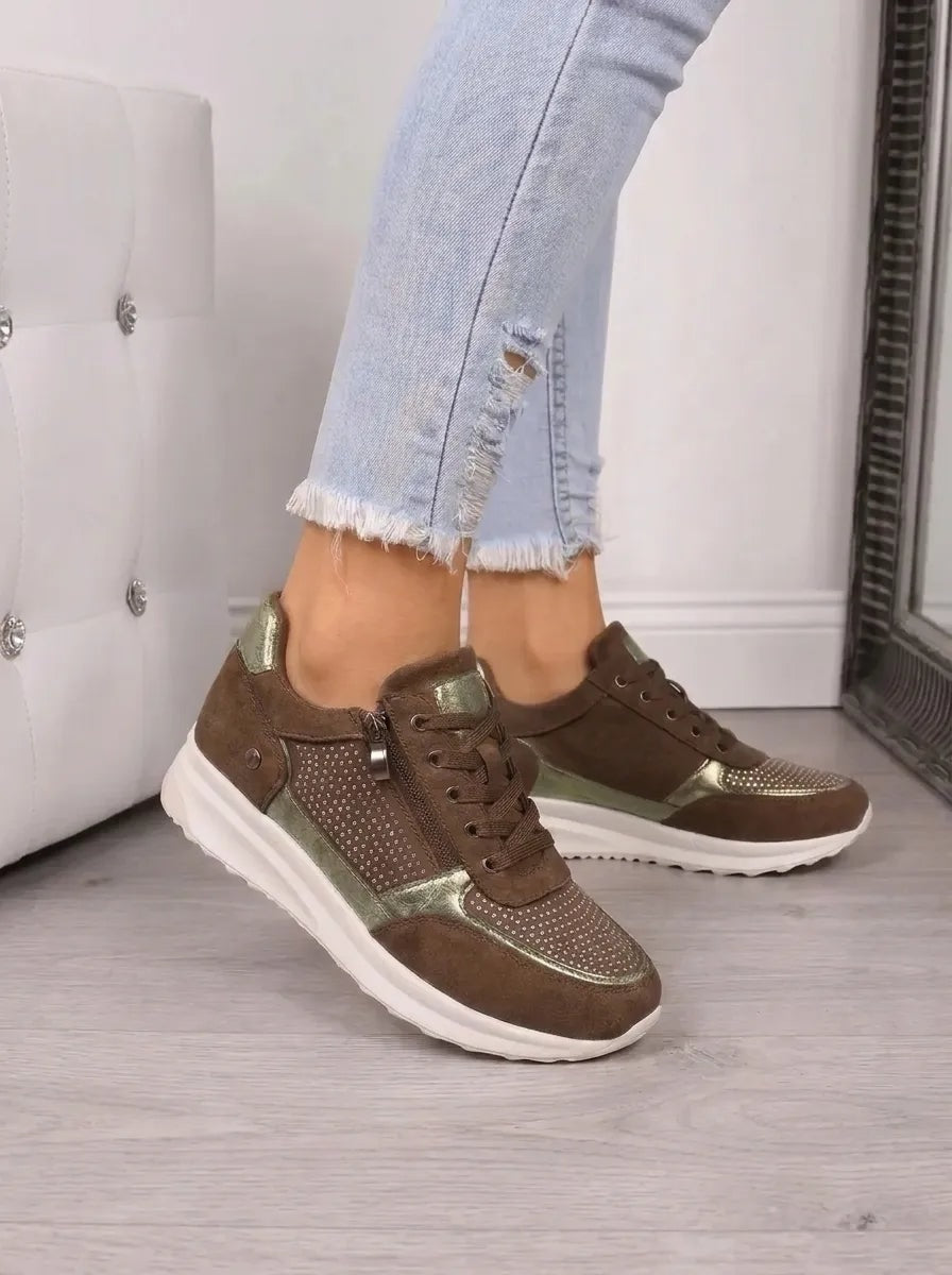 Brown low-top sneakers with olive metallic accents, sparkling panels, lace-up fronts, and contrasting white soles.