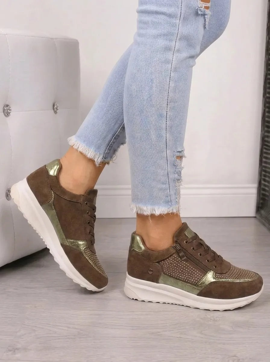 Side profile of brown sneakers with olive metallic panels, sparkling side detailing, lace-up fronts, and thick white soles.